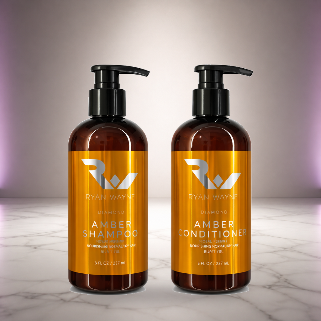 Ryan Wayne Diamond Amber Shampoo and Conditioner Duo on white marble with soft plum lighting