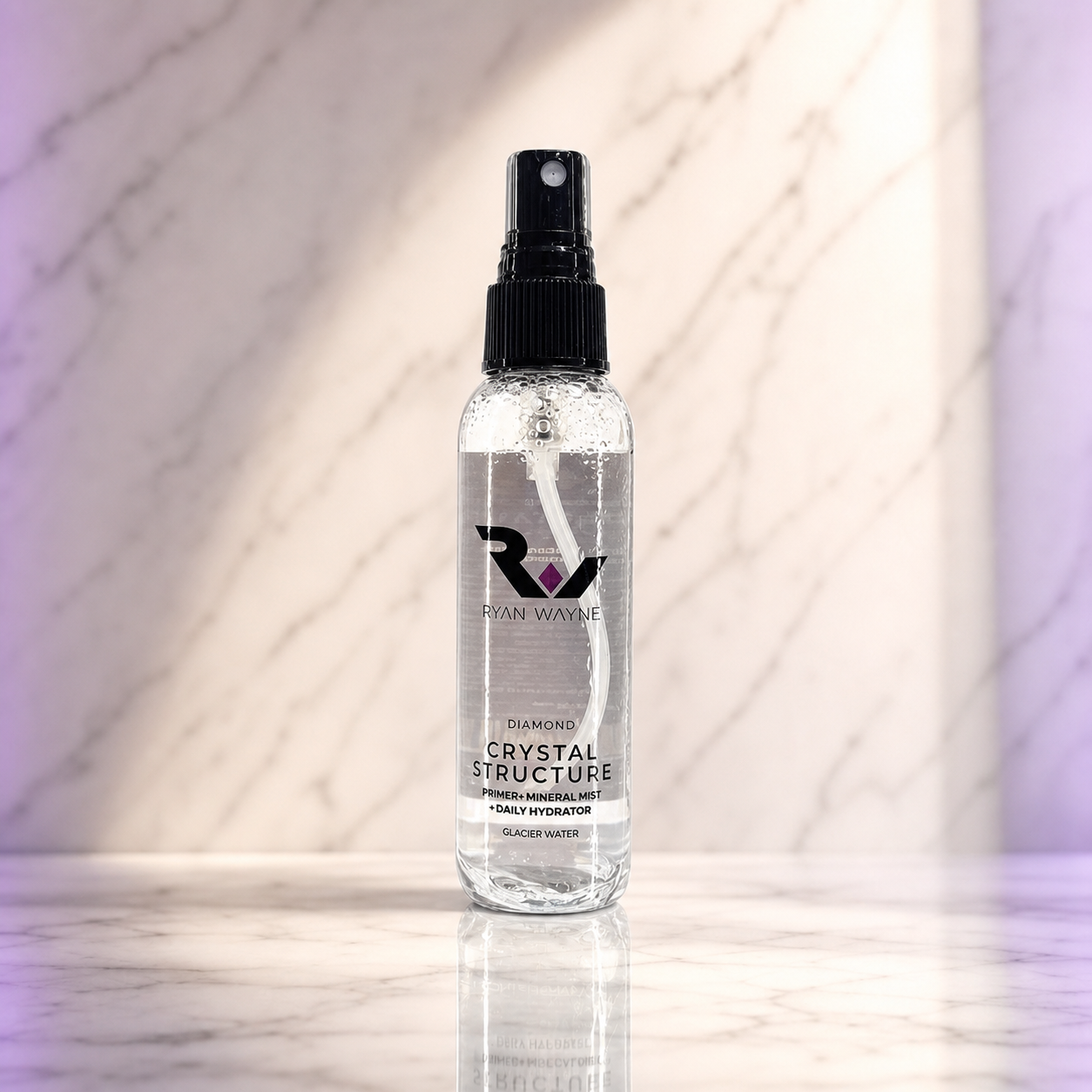 Ryan Wayne Diamond Crystal Structure Primer and Mineral Mist travel size on white marble with plum lighting