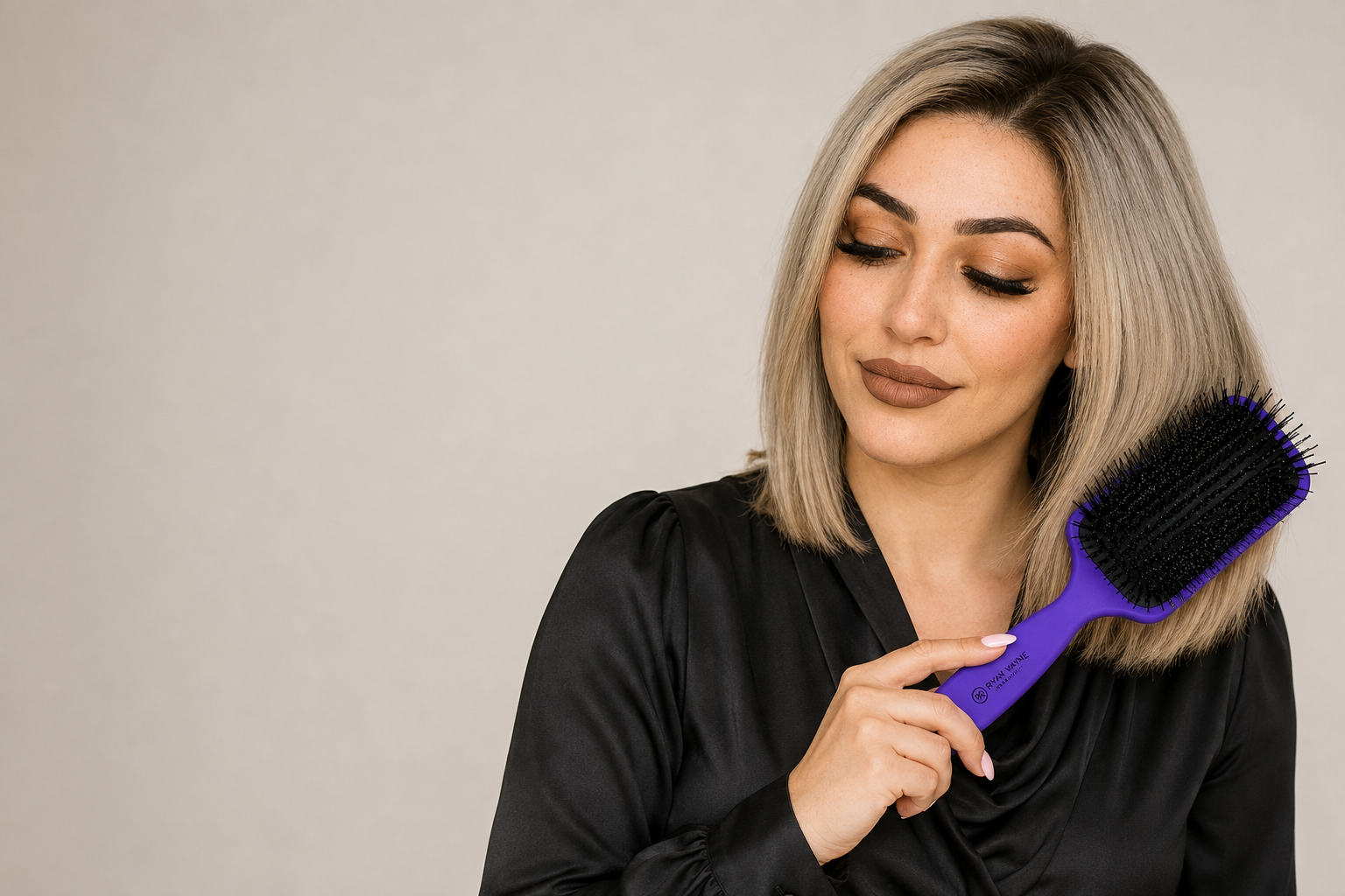 Model brushing glossy hair correctly with Ryan Wayne purple luxury paddle brush