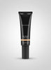 Black cosmetic tube with clear packaging on a dark surface