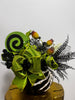 Decorative Halloween flower arrangement with green ribbons and black accents on a white background