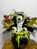 Decorative headband with green and black accents on a white background