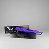 Purple flat iron with black box on a light gray background