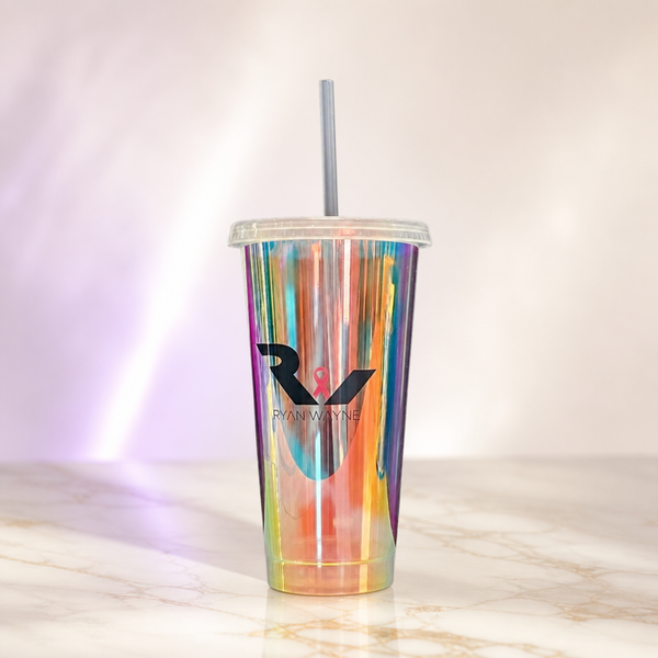 Ryan Wayne Cares holographic tumbler with straw on white marble
