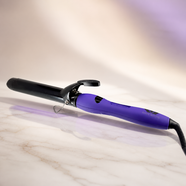 Ryan Wayne purple ceramic curling iron on white marble