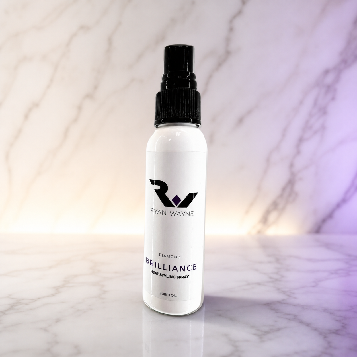 Ryan Wayne Diamond Brilliance Heat Shielding Styling Spray travel size on white marble with plum lighting