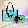 Ryan Wayne holographic tote and zippered makeup bag on white marble