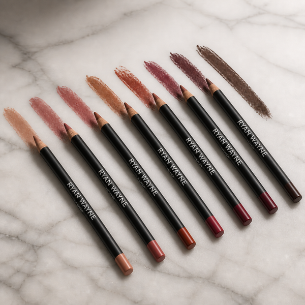 Slim Ryan Wayne Lip Liner Pencils in seven representative shades on white marble