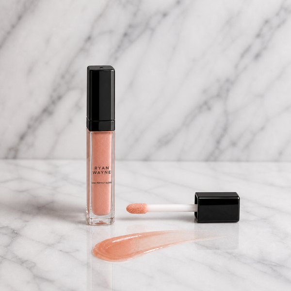 Ryan Wayne One Perfect Gloss slim bottle and straight applicator on white marble
