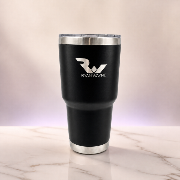 Ryan Wayne black 30 oz tumbler on white marble with soft plum lighting