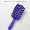 Ryan Wayne Wet-to-Dry Detangling Brush on white marble